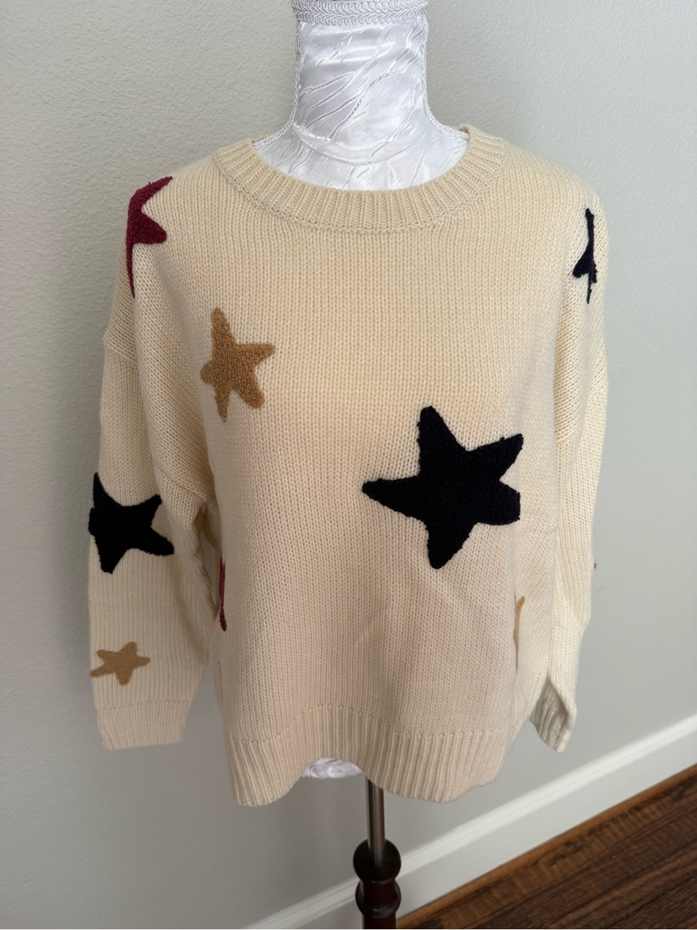 Altar'd State Cream Star Intarsia Crewneck Sweater with Black, Gold & Red Stars